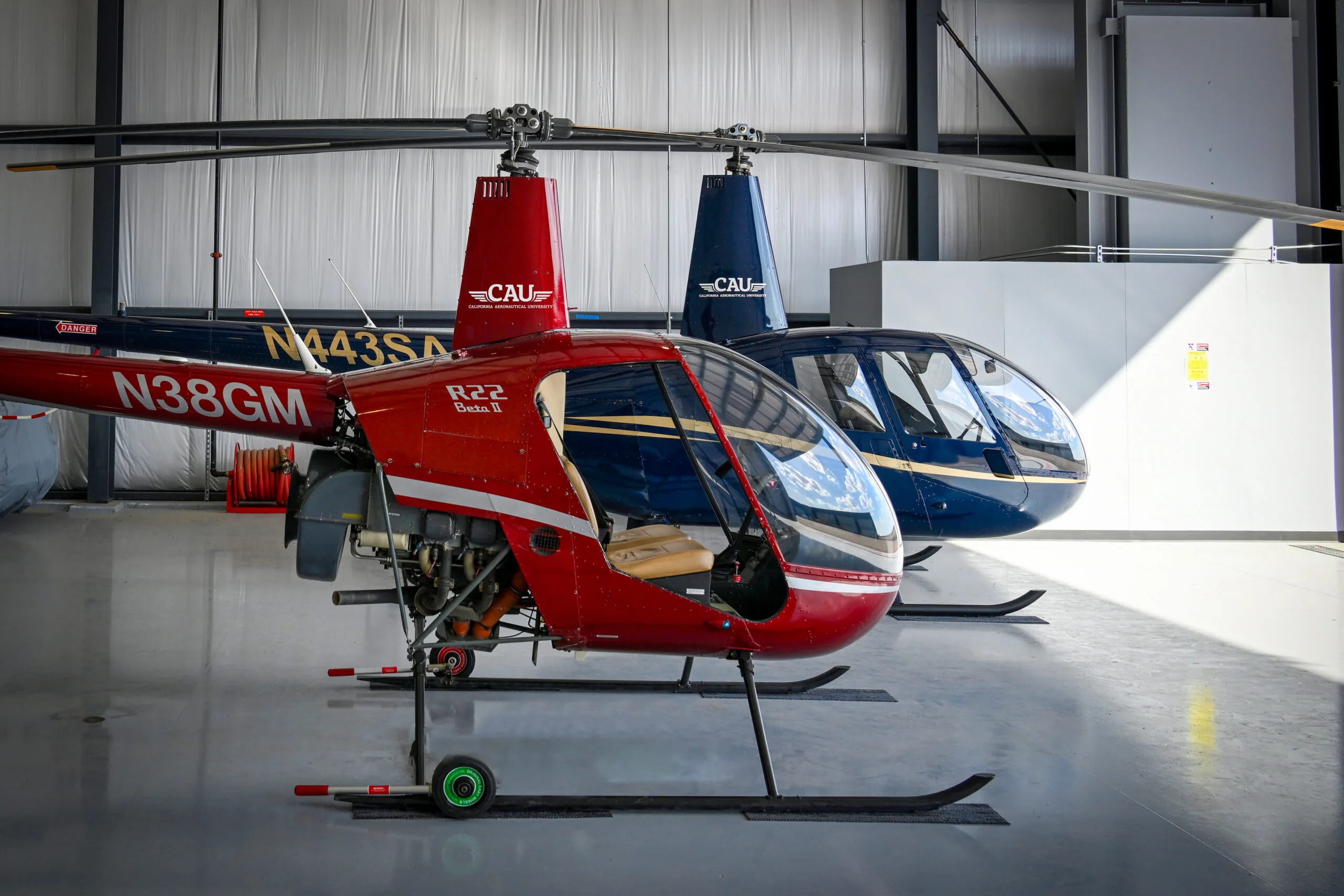 Robinson R44 and R22 Helicopter side-by-side.