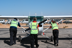 Cau Flight Team Pushing Plane 2026 Regionals 300x200
